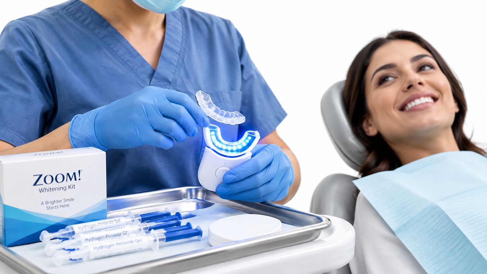 A dental professional holding a Zoom whitening tray with a patient smiling in the background.